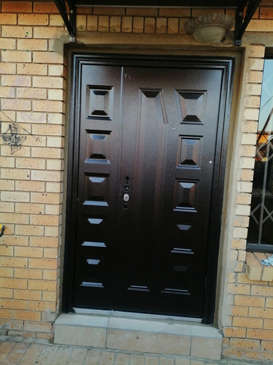 329 Golden Brown Two-Panel Pivot Security Door Installation – Gauteng